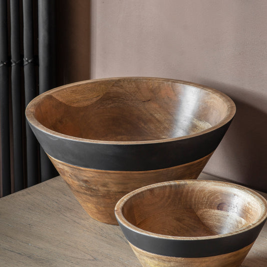 image shows the large bowl on a wooden surface behind a smaller version of the same bowl 